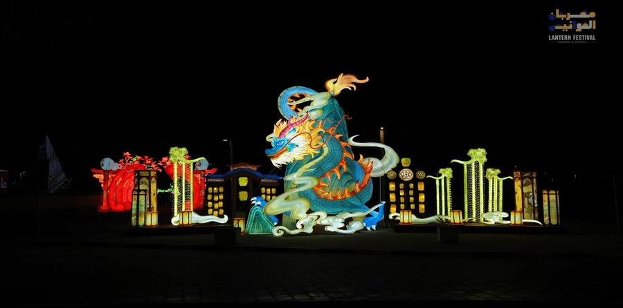 Illuminated dragon lantern installation at night