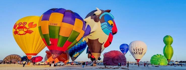 Colourful hot air balloons inflating at Katara